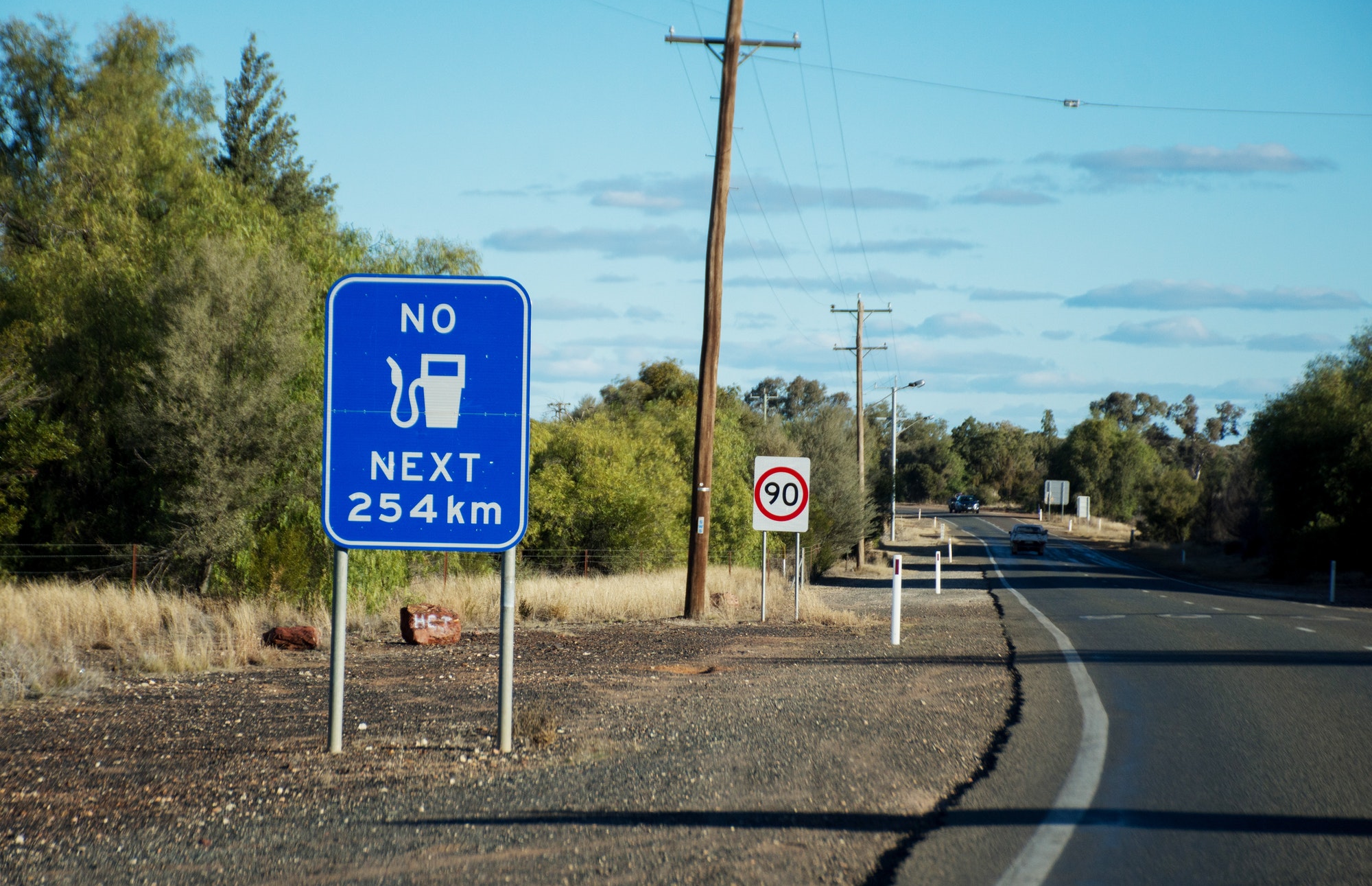 Reality of Australian Outback. “No fuel next 254 km” sign. Cobar, New South Wales, Australia.